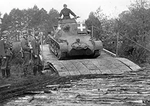 Swiftly: An armored command post vehicleI B crosses a bridge