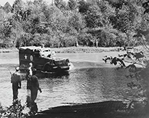 Tennessee: An armored half-track vehicle crossing the