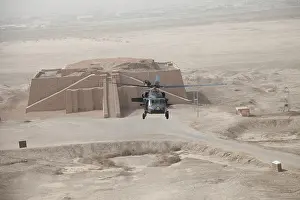 Ziggurat: A US Army Black Hawk helicopter hovers above ?