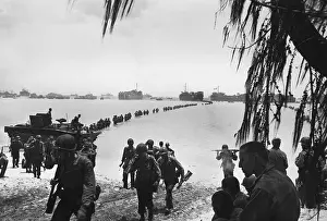 Forager: Army reinforcements wade ashore on Saipan without