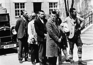 Oppression: Arrested men arrive at the Dachau concentration camp, 1933