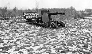 Terms: Artillery piece tinkered of scrap, as a critique of the