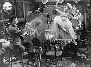 Bohemians: An artist painting a posing model