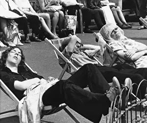Dozing: Asleep in deckchairs - Piccadilly, Manchester