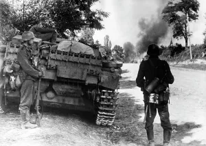 Accompanying: Assault gun and infantry of the Wehrmacht on the Eastern