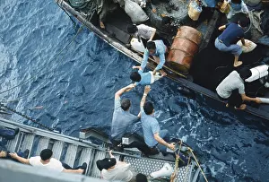 Southeast Asia: Assistance to Boat People, in a small craft on