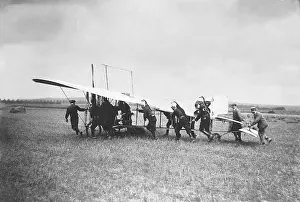 Assistants: Assistants push Bleriot's airplane, 1909