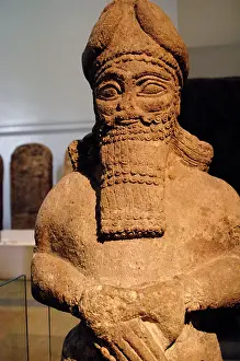 Attendant: Assyrian figure of an attendant god. Nimrud