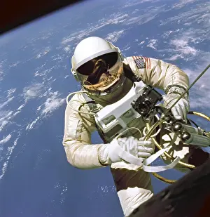 Umbilical: Astronaut Edward White floats in space. ?