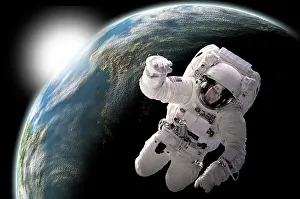 Unrecognizable: Astronaut floating in outer space with visible sunrise from