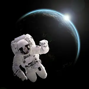 Luminous: Astronaut floating in space as the sun rises on an ?