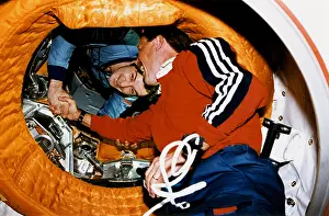 Handshakes: Astronaut Robert Gibson, greets Cosmonaut ?
