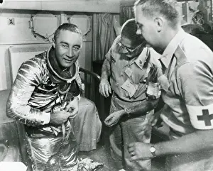 Starts: Astronaut Virgil ?Gus? Grissom starts to remove his spa?