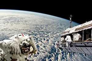 Unrecognizable: Astronauts performing work on a space station while ?