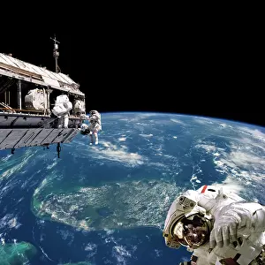 Extravehicular: Astronauts performing work on space station while orbiting