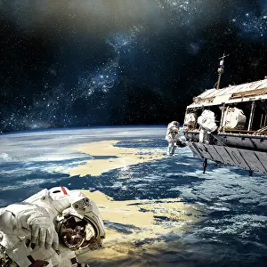 Unrecognizable: Astronauts working on space station while orbiting an ?