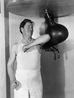 Workout: Athlete working out with a punching bag