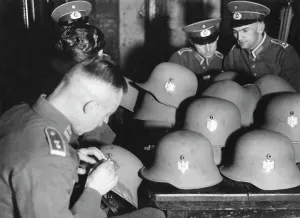 Claws: Attaching badges on steel helmets, 1934