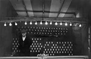 Attendant at dart throwing fairground stall