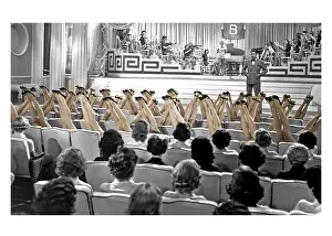 Surrealism: Auditorium with band on stage and audience of legs