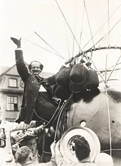 Ascend: Auguste Piccard waves as he climbed into the spherical