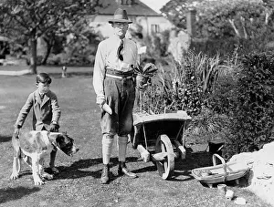 Newfoundland: Austen Chamberlain working in the garden with his son