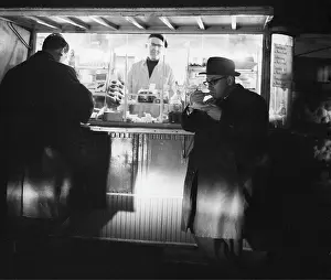 Snacks: Austrian critic and writer Hans Weigel at a sausage stan