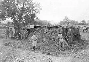 Coated: Austrian soldiers build mud huts, 1915