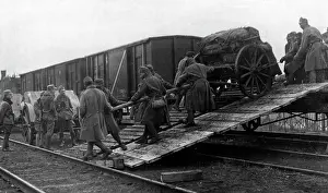 Artillerymen: Austro-Hungarrian artillerymen unload a train, 1918
