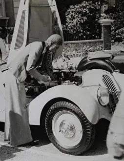 Concours: An automobile driver in front of her