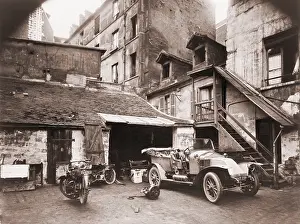 Garages: Automobile and two motorcycles in courtyard ?