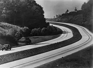 Accelerated: An automobile on the sweeping curves of ?