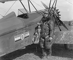 Bi Plane: Aviator standing with plane labeled Cleveland Pittsburgh