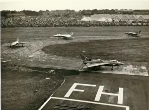 707s: Four Avro 707s taxi past the crowd
