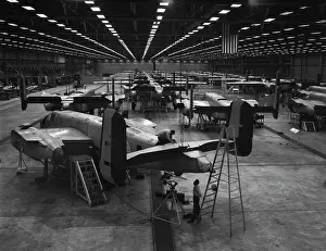 Responsible: B-25 Mitchell airplanes on the floor of an assembly plant