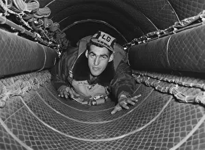 Air Force: B-29 gunner in the 35-foot tunnel connecting the