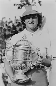 Oshanter: Babe Didrikson Zaharias holding trophy after the