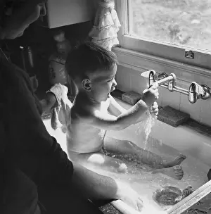 Sink: BABY BATHING IN THE SINK