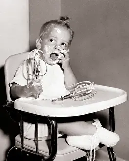 Highchair: Baby Boy with Messy Hands and Face Sitting in