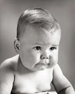 Jowls: Baby with Serious Facial Expression