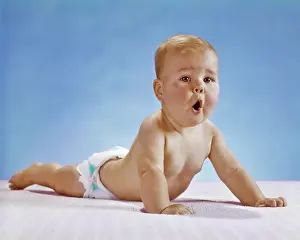 Pushup: Baby with Funny Facial Expression Doing Pushup
