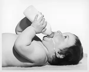 Spilt: A BABY HAVING A DRINK