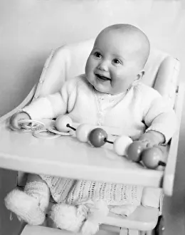 Knitted: BABY IN A HIGH CHAIR