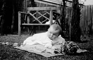 Infants: Baby lying in the garden