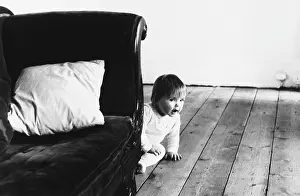 Peeking: Baby peeking from behind a chair