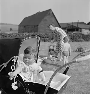 Weatherboarded: Baby In A Pram
