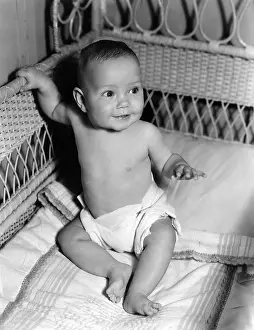 Ov201912: Baby sitting up in crib