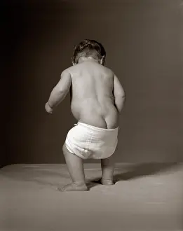 Diapers: Baby Standing With Diaper Falling
