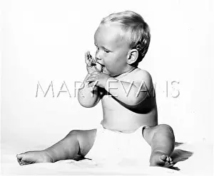 Suck: A BABY SUCKING HIS THUMB
