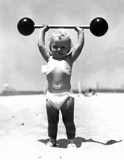 Imitating: Baby weight lifter